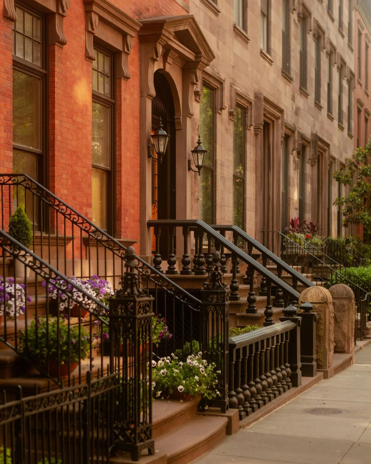 Upper West Side brownstone stoop with ornate iron railings